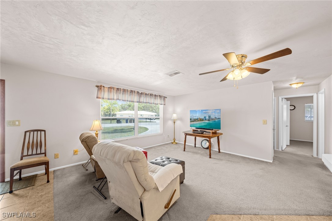2551 Barcelona Avenue Fort Myers, FL 33905 - Photo 4 of 41 a living room with furniture and a large window