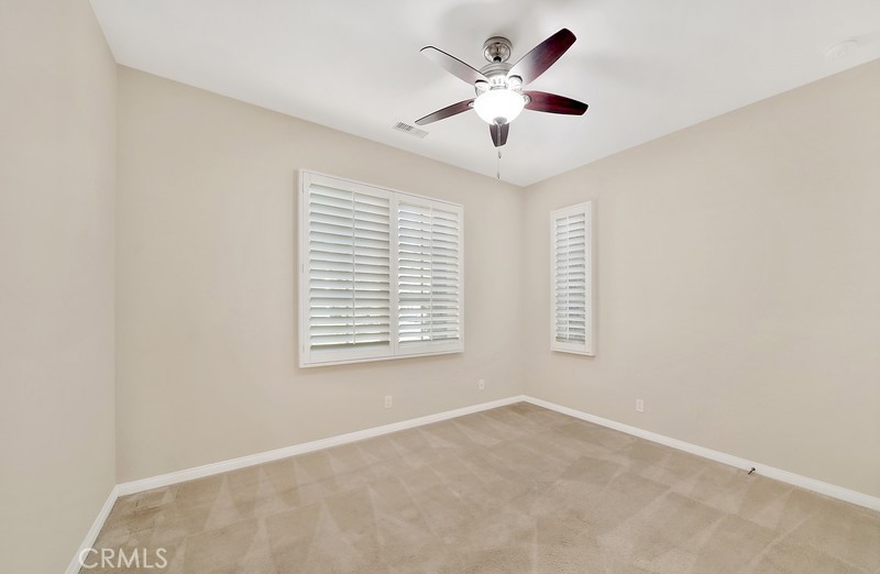 45 Cipresso Irvine, CA 92618 - Photo 11 of 30 an empty room with a window and a fan