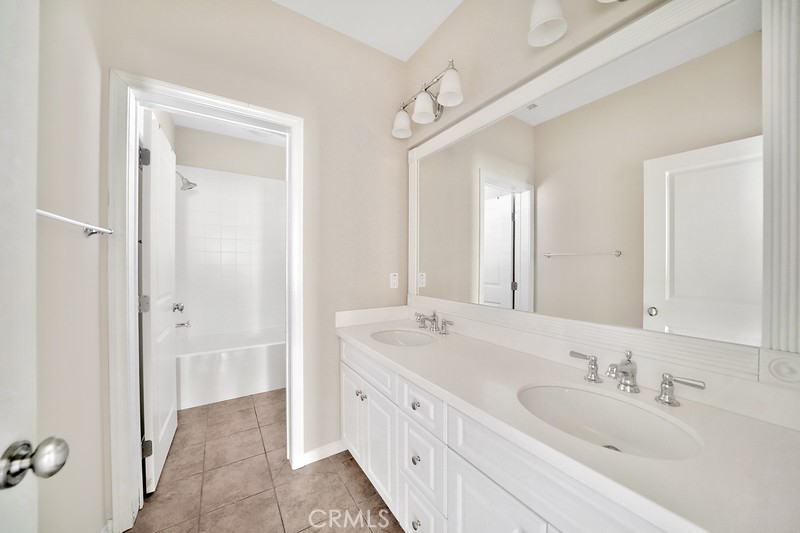 45 Cipresso Irvine, CA 92618 - Photo 14 of 30 a spacious bathroom with a double vanity sink mirror and