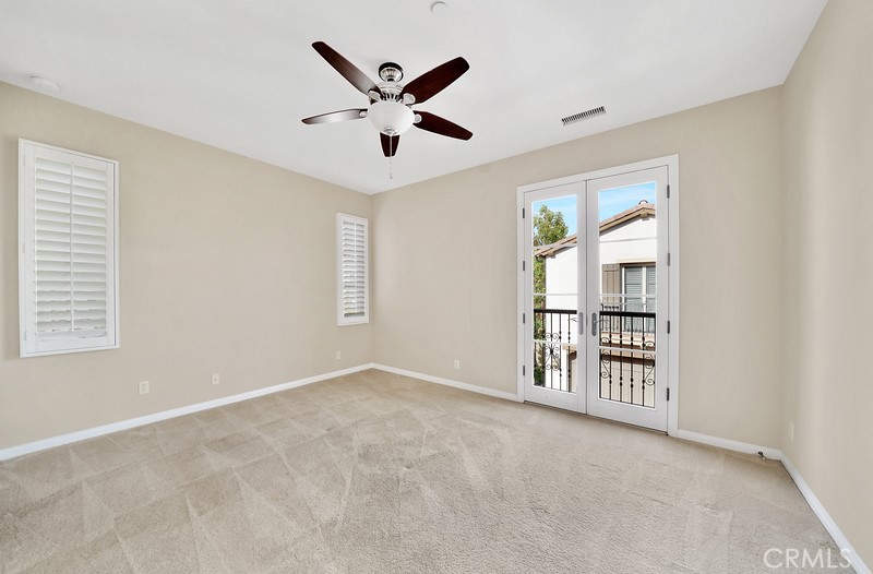 45 Cipresso Irvine, CA 92618 - Photo 16 of 30 an empty room with windows and fan