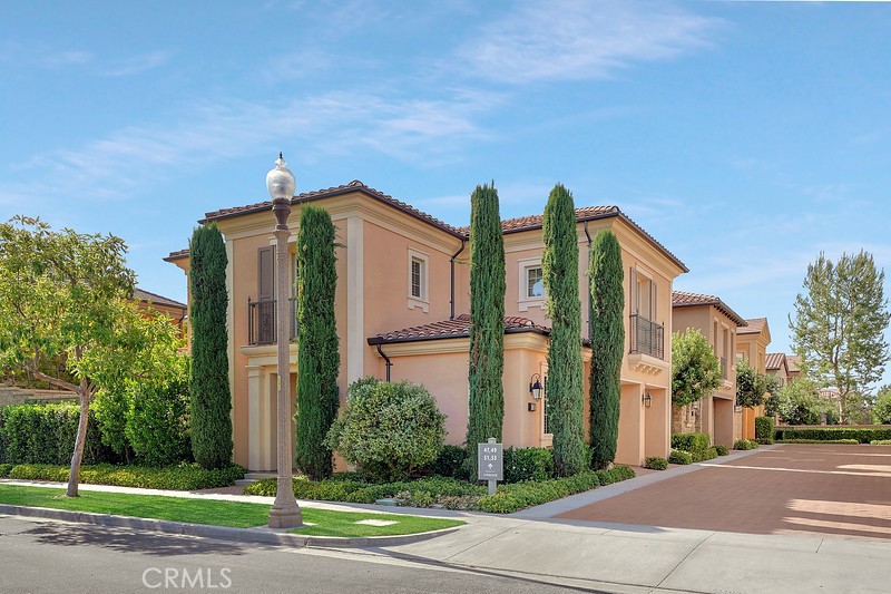 45 Cipresso Irvine, CA 92618 - Photo 2 of 30 a front view of a building with a garden and plants