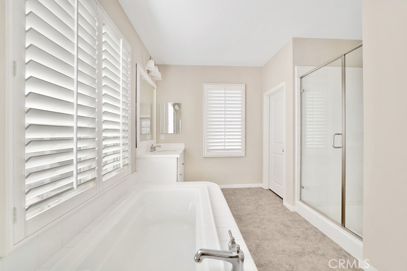 45 Cipresso Irvine, CA 92618 - Photo 21 of 30 a bedroom with a bed and a window