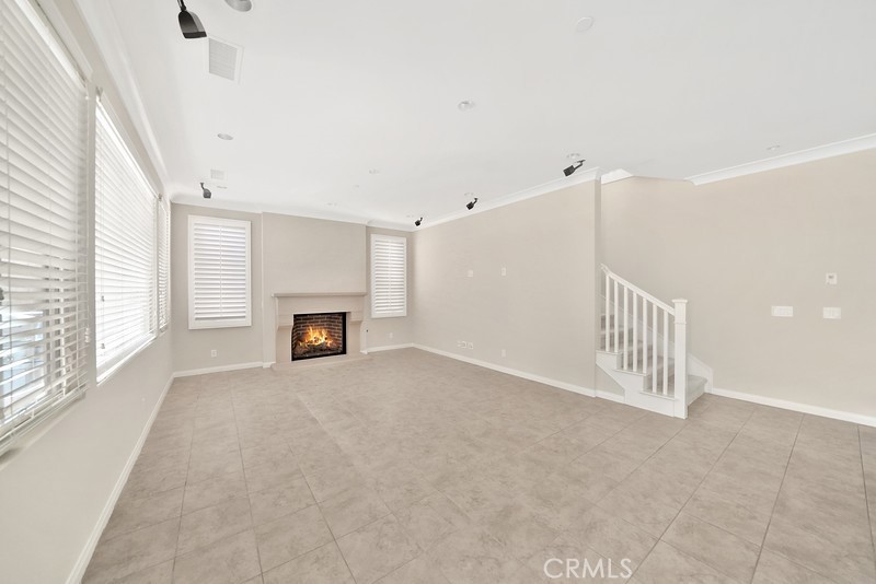 45 Cipresso Irvine, CA 92618 - Photo 4 of 30 a view of an empty room with a fireplace and a window