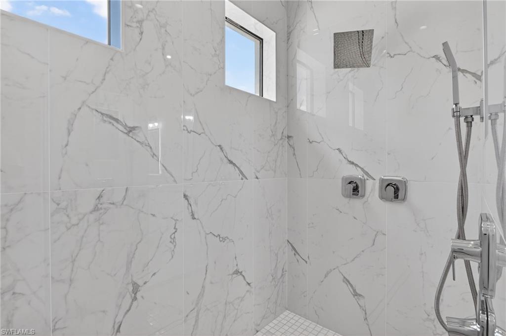 563 15th Street Northwest Naples, FL 34120 - Photo 8 of 22 a bathroom with a shower
