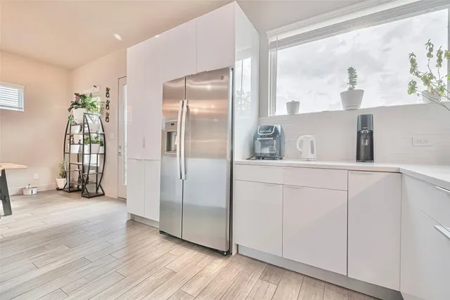 a view of kitchen with furniture and wooden floor