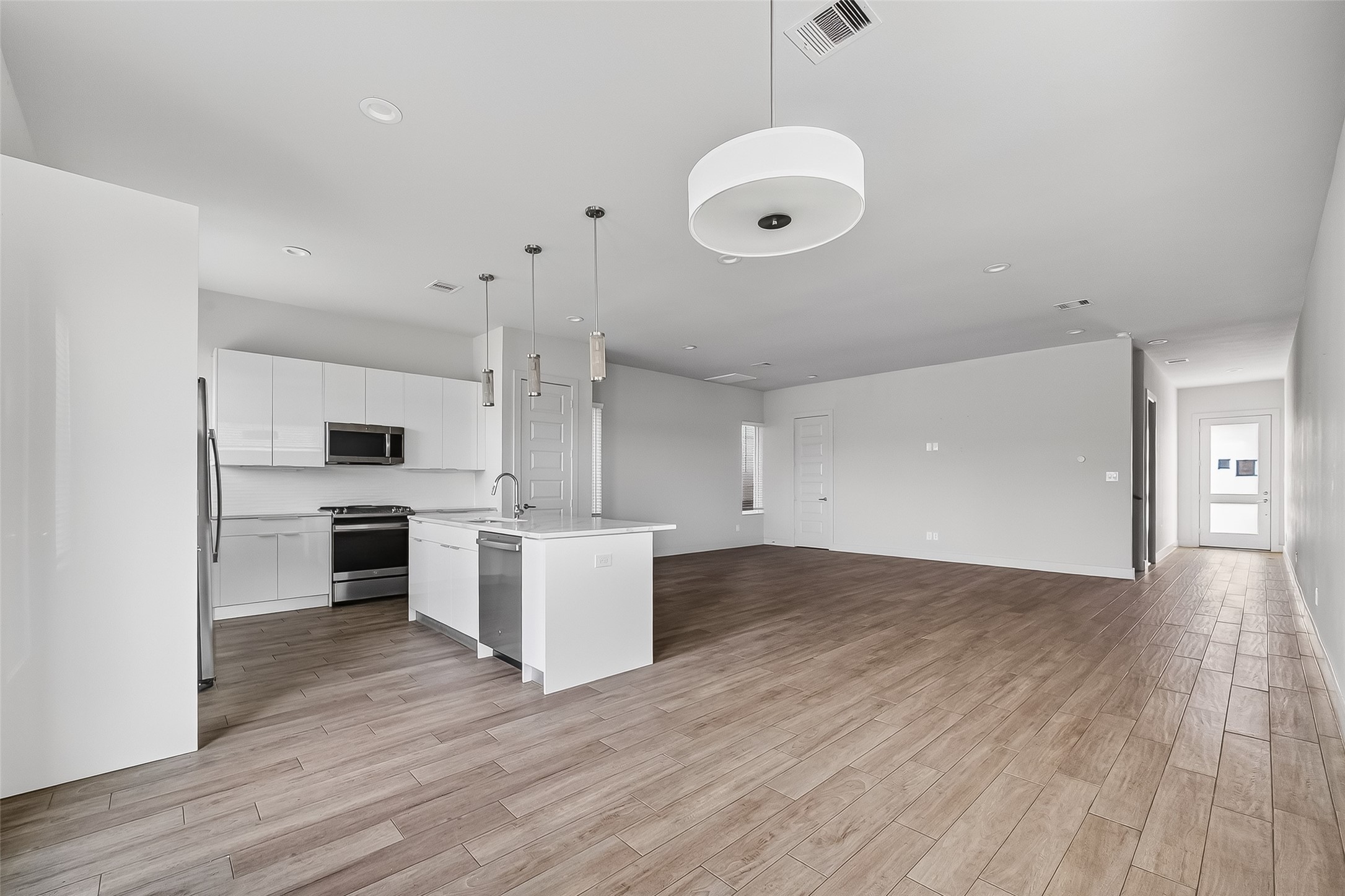 5703 Pampero Lane Houston, TX 77092 - Photo 13 of 41 a view of kitchen with sink and wooden floor