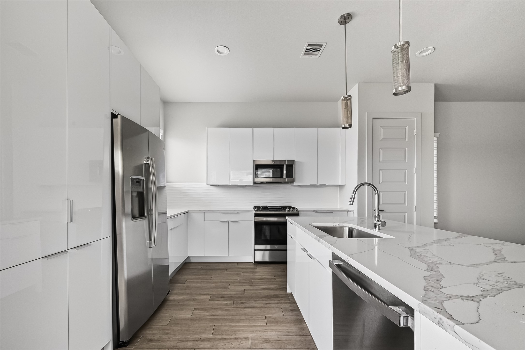 5703 Pampero Lane Houston, TX 77092 - Photo 15 of 41 a kitchen with a sink a stove and refrigerator