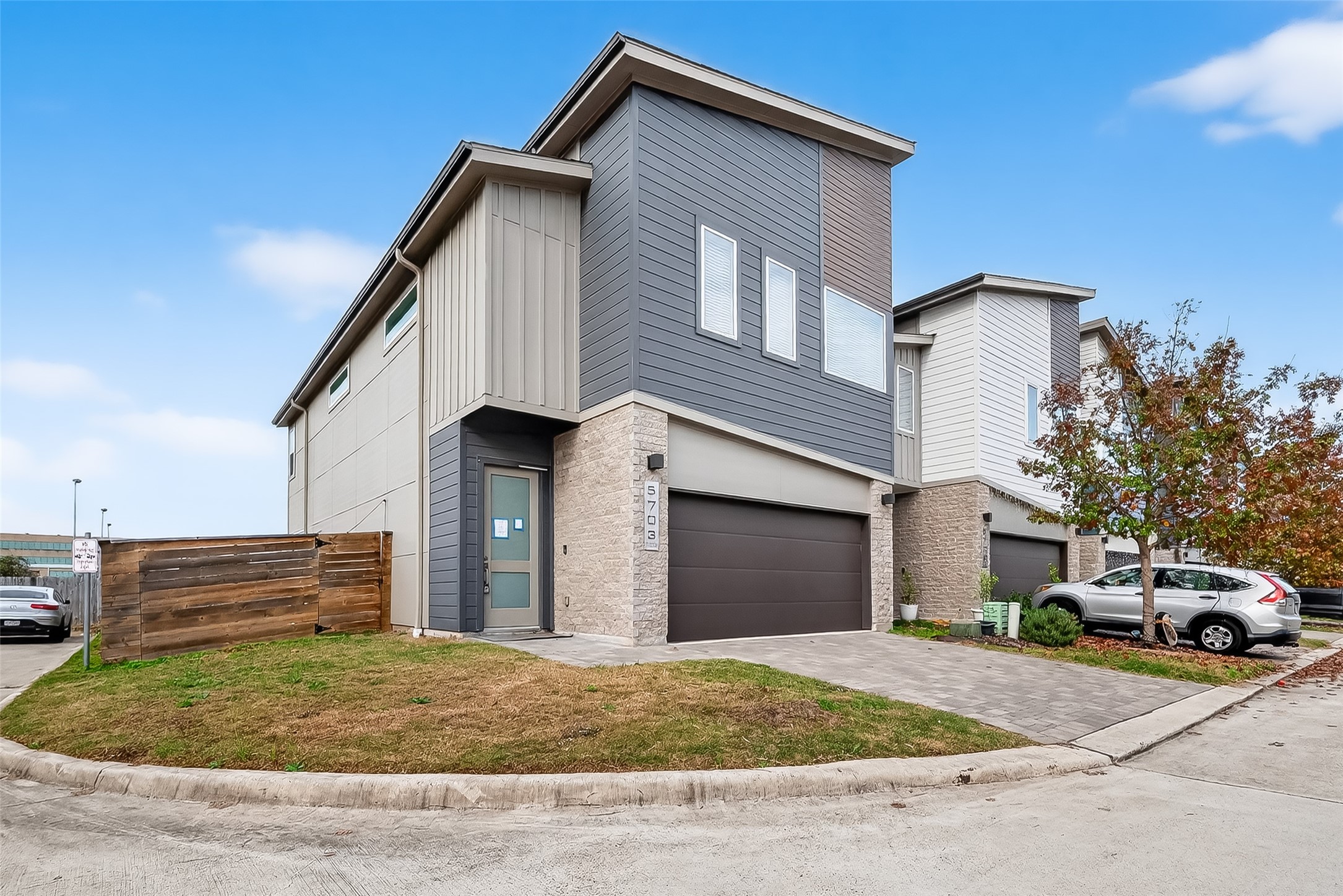 5703 Pampero Lane Houston, TX 77092 - Photo 2 of 41 a front view of a house with a yard and garage