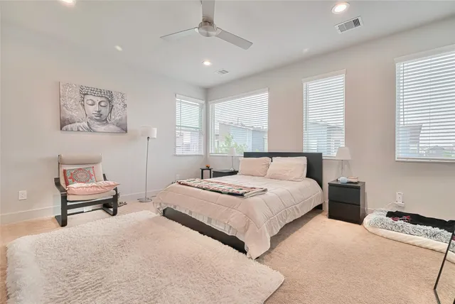 a bedroom with a bed and a couch