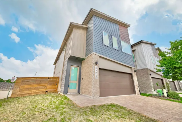 a front view of a house with a garage
