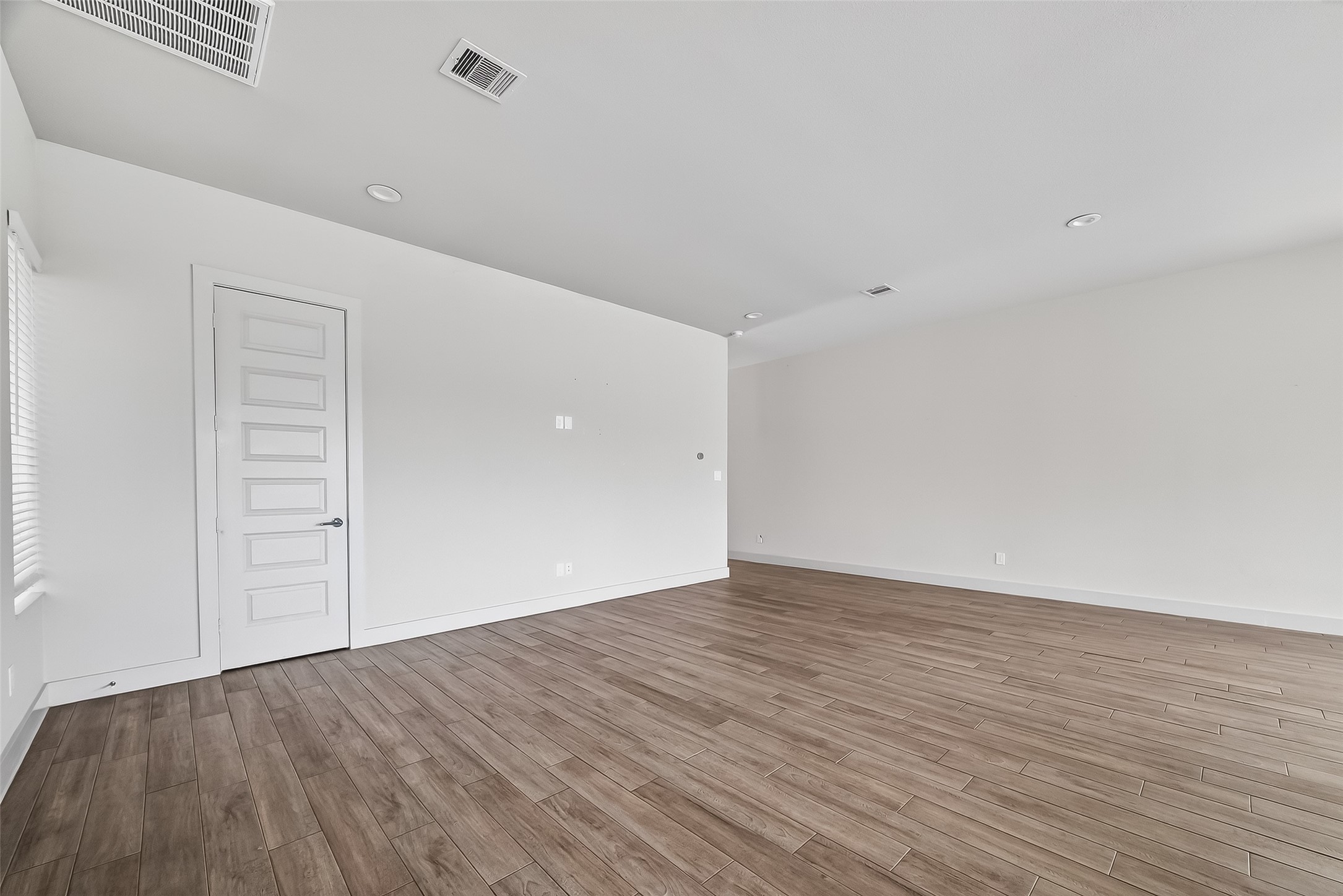 5703 Pampero Lane Houston, TX 77092 - Photo 6 of 41 a view of an empty room with wooden floor