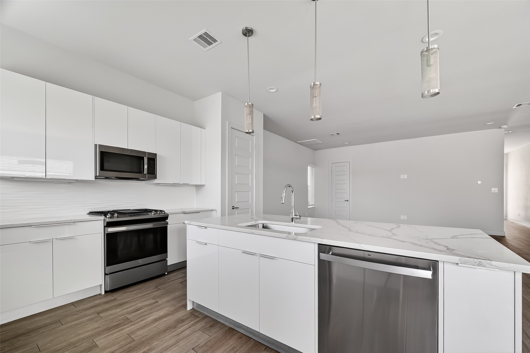 5703 Pampero Lane Houston, TX 77092 - Photo 10 of 41 a kitchen with a sink appliances and cabinets