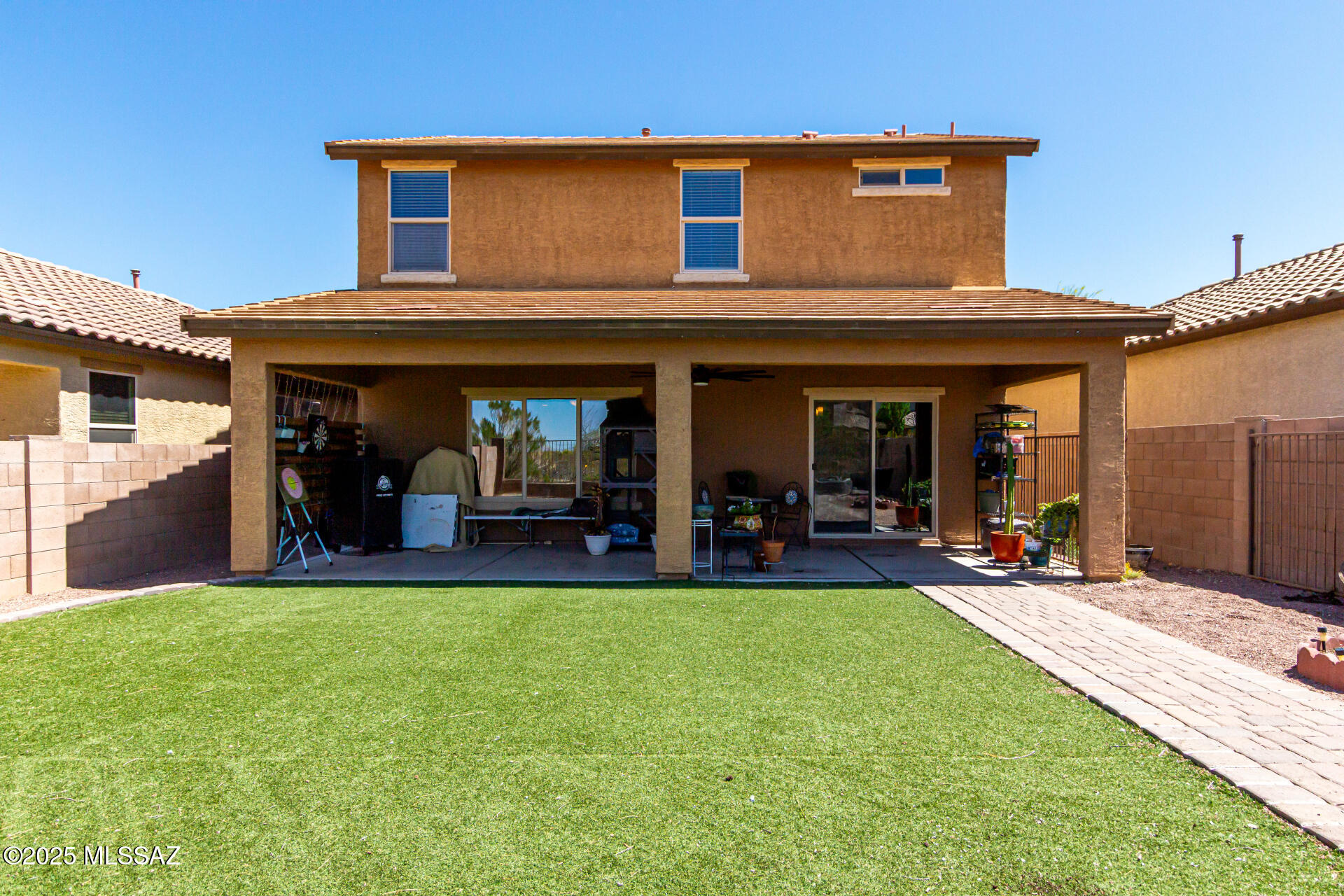 9528 Desert Fauna Loop Tucson, AZ 85747 - Photo 35 of 46 a view of a house with patio and a yard