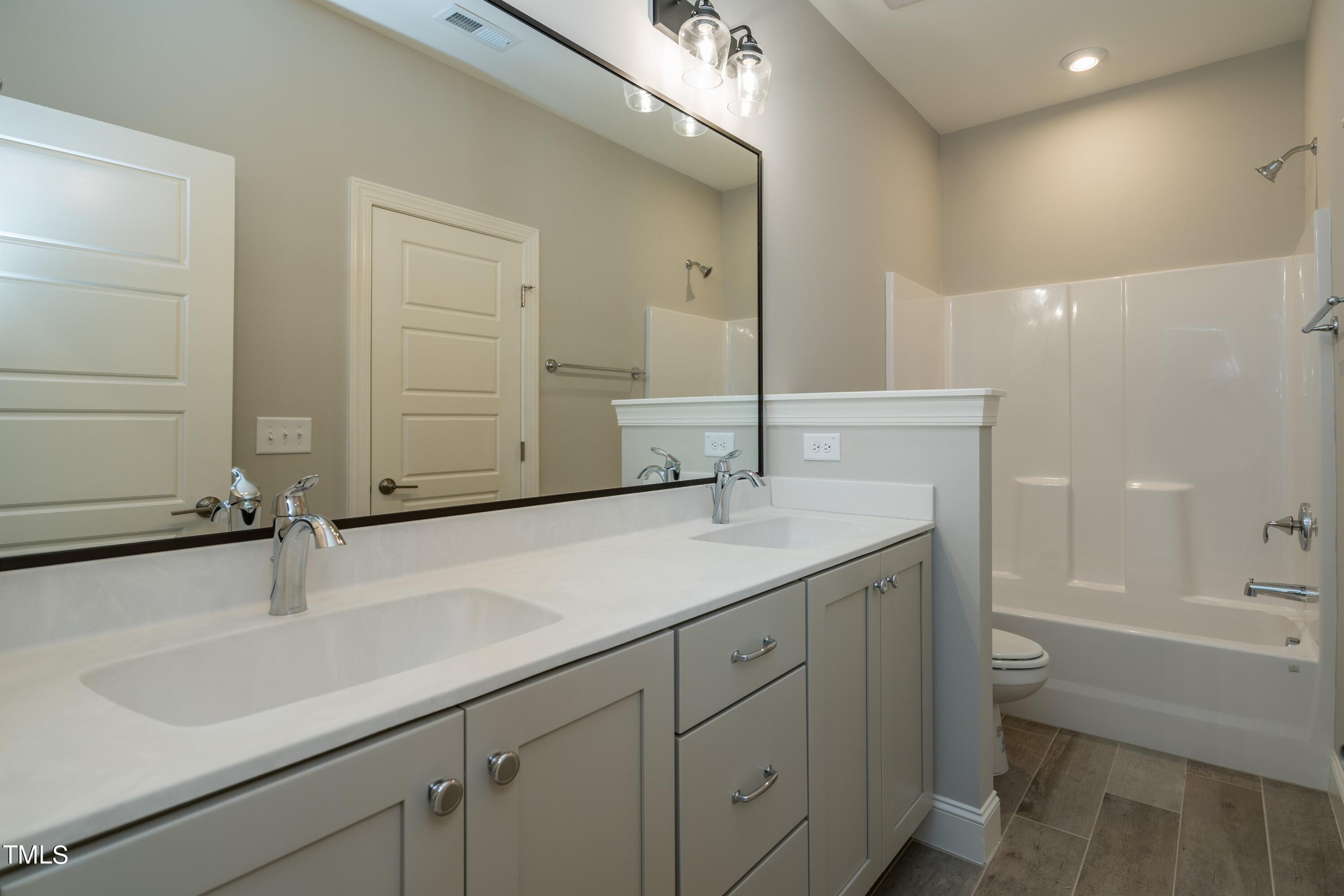 6020 Scalybark Road Durham, NC 27712 - Photo 20 of 29 021_ Hallway Full Bathroom