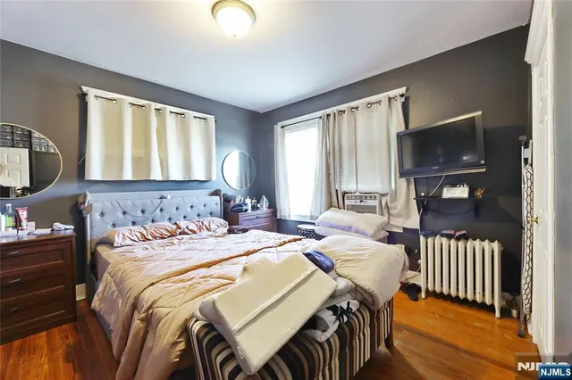 a bedroom with a bed and a walk in closet