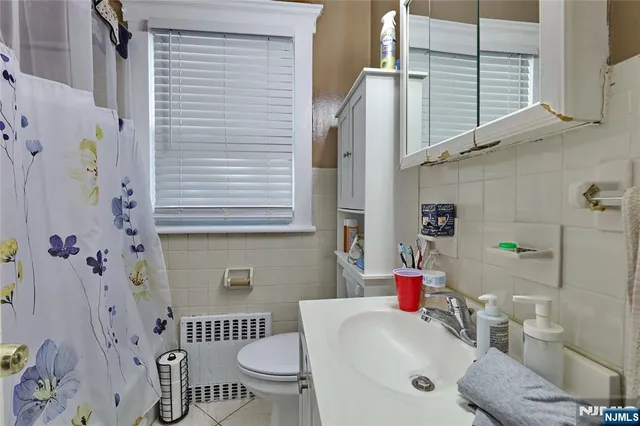 a view of a storage & utility room with two washing machine