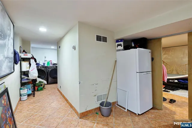 a bedroom with furniture and a gym equipment