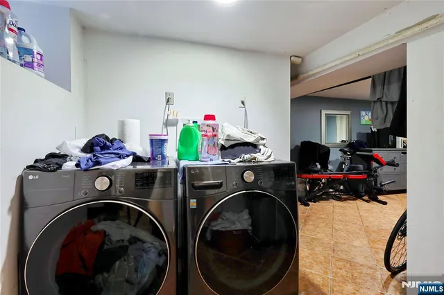a bathroom with a sink a toilet and shower curtain