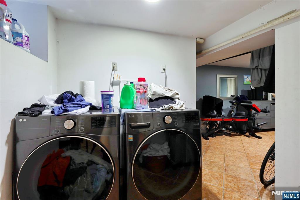 274 Goffle Road Hawthorne, NJ 07506 - Photo 17 of 31 a utility room with sink dryer and washer