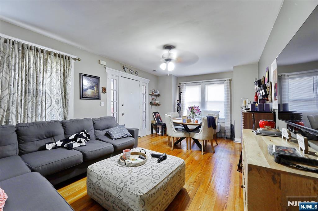 274 Goffle Road Hawthorne, NJ 07506 - Photo 9 of 31 a living room with furniture and a flat screen tv