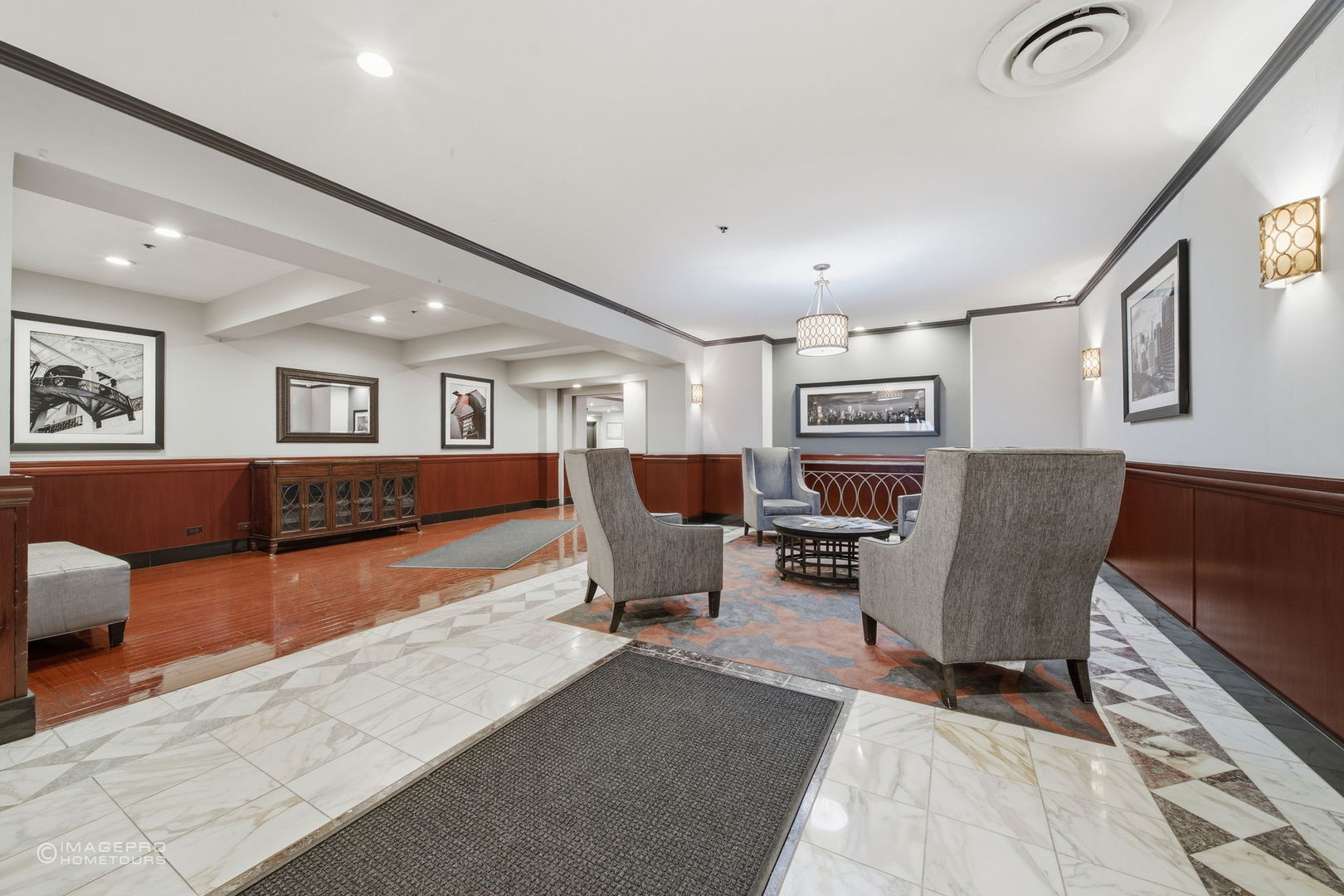40 East 9th Street, Unit 712 Chicago, IL 60605 - Photo 21 of 26 a living room with furniture and a dining table with wooden floor