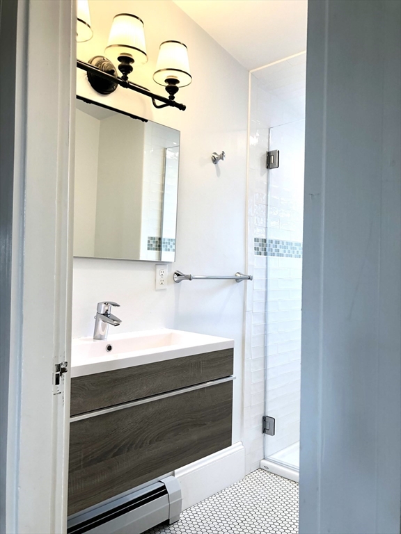 3 Chester Road, Unit 3 Belmont, MA 02478 - Photo 25 of 40 a bathroom with a sink and a mirror