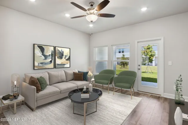 a kitchen with granite countertop a refrigerator stove top oven and sink