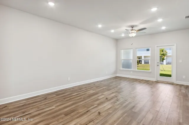 a bedroom with a bed and a potted plant