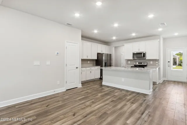 a bathroom with a sink a toilet and a bathtub