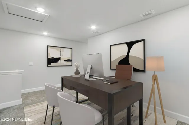 a group of people sitting in front of a house