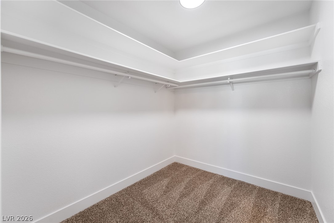 429 Crestway Road Henderson, NV 89015 - Photo 28 of 56 Ample shelving and hanging space defines this well-lit walk-in closet.