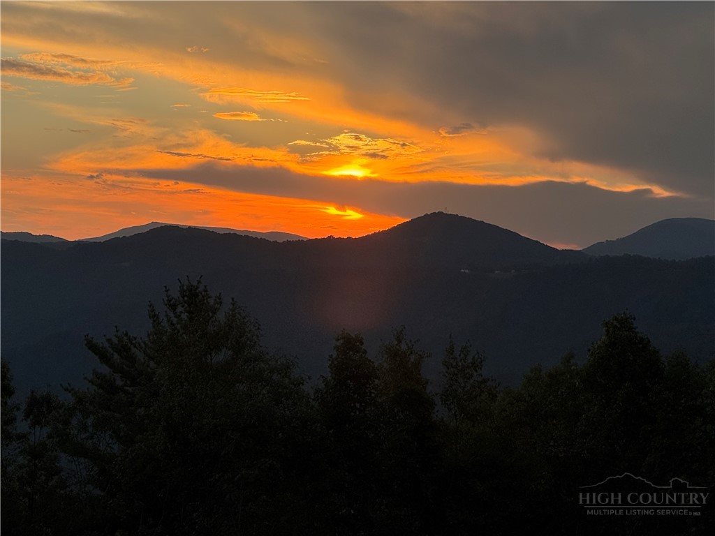 147 Angelfire Trail Deep Gap, NC 28618 - Photo 6 of 10 a view of mountain with sunset in background
