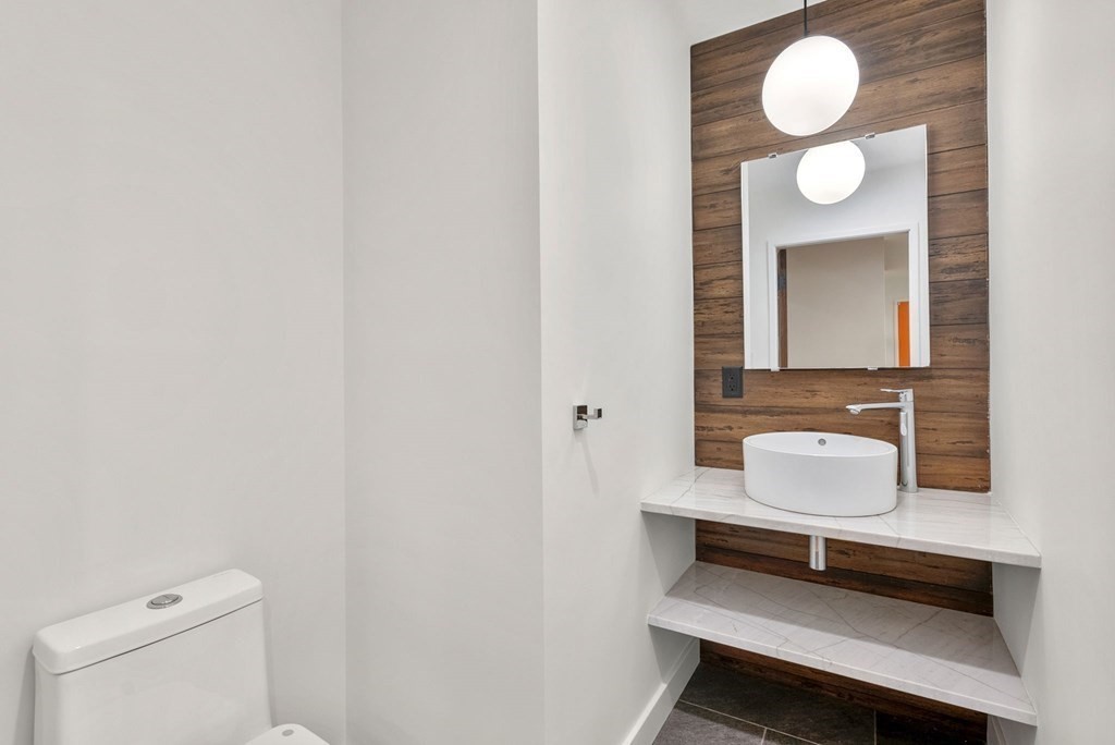 7 Spruce Hill Road Weston, MA 02493 - Photo 16 of 40 a bathroom with a toilet sink and mirror