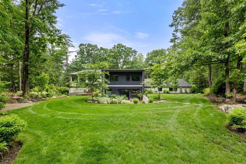 7 Spruce Hill Road Weston, MA 02493 - Photo 2 of 40 a view of a backyard with a garden