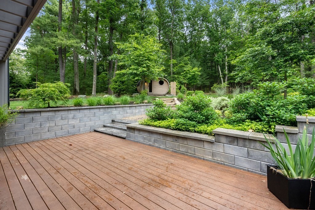7 Spruce Hill Road Weston, MA 02493 - Photo 22 of 40 a view of a terrace with a garden