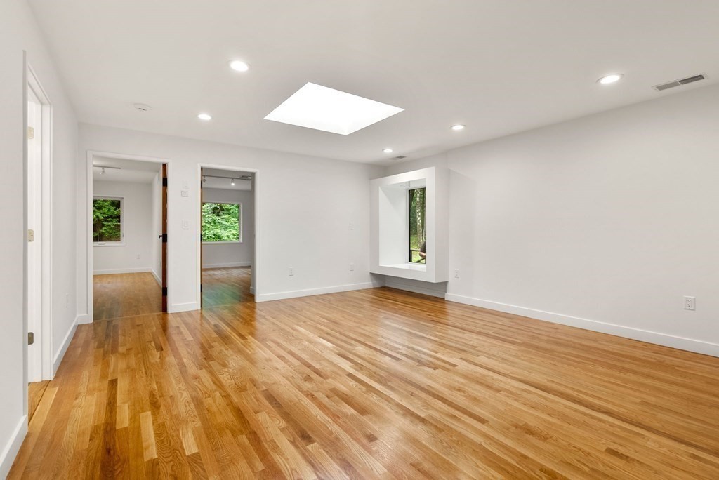 7 Spruce Hill Road Weston, MA 02493 - Photo 23 of 40 a view of an empty room and wooden floor