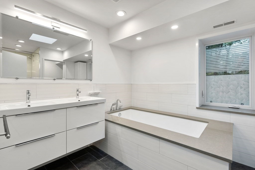 7 Spruce Hill Road Weston, MA 02493 - Photo 27 of 40 a bathroom with a sink and a bathtub