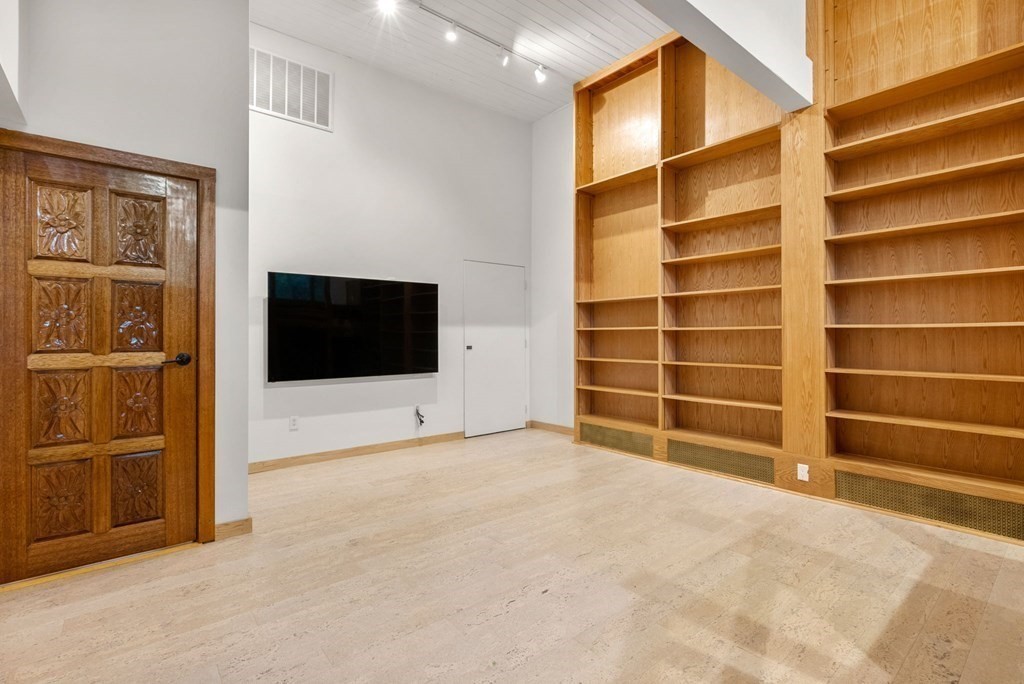 7 Spruce Hill Road Weston, MA 02493 - Photo 29 of 40 a view of an empty room with a cabinet and a window