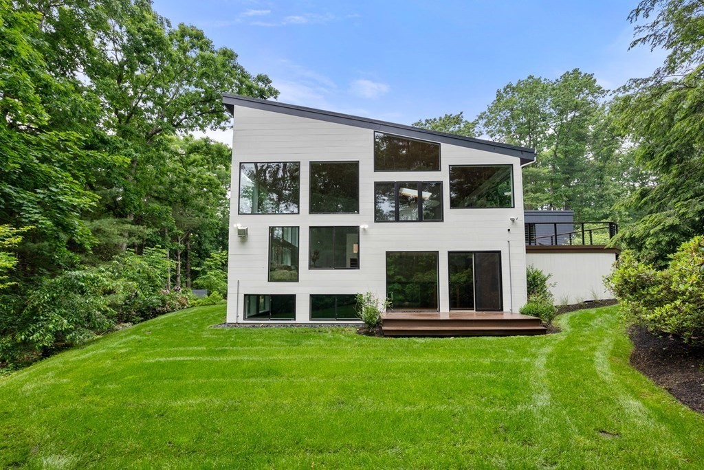 7 Spruce Hill Road Weston, MA 02493 - Photo 3 of 40 a front view of a house with a yard