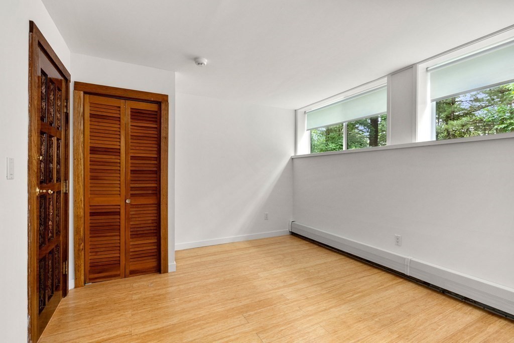 7 Spruce Hill Road Weston, MA 02493 - Photo 31 of 40 an empty room with windows