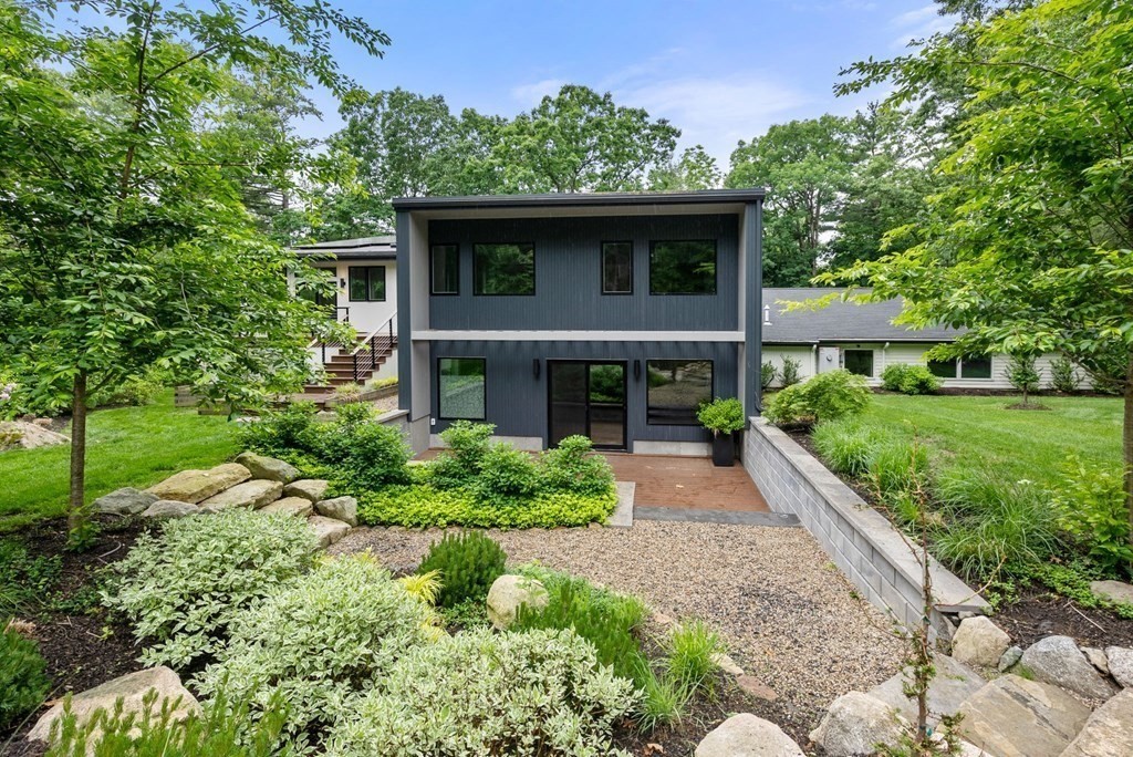 7 Spruce Hill Road Weston, MA 02493 - Photo 35 of 40 a front view of a house with a yard