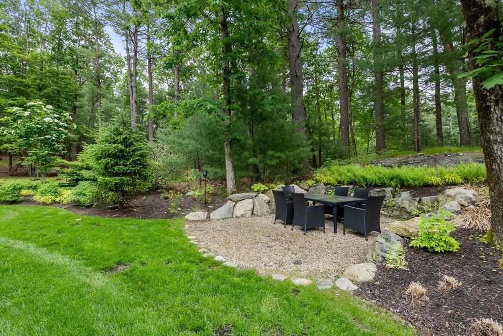 7 Spruce Hill Road Weston, MA 02493 - Photo 38 of 40 a view of a garden with plants and trees