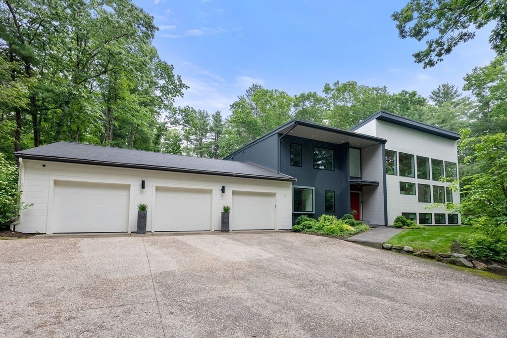 7 Spruce Hill Road Weston, MA 02493 - Photo 40 of 40 a front view of a house with a yard and garage