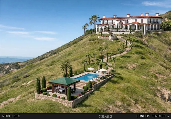 a view of swimming pool with outdoor seating and yard in back