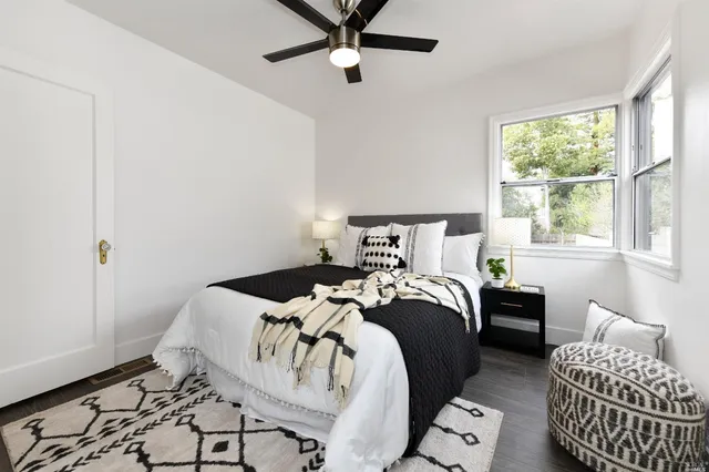 a bedroom with a bed and window