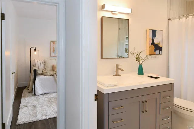 a en suite bathroom with a sink and mirror