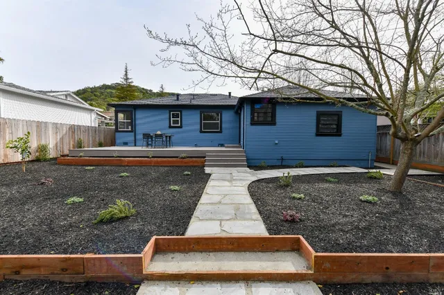a front view of a house with garden