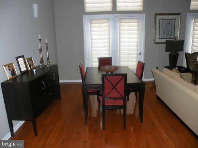 12000 Market Street, Unit 438 Reston, VA 20190 - Photo 5 of 13 a dining room with furniture and window