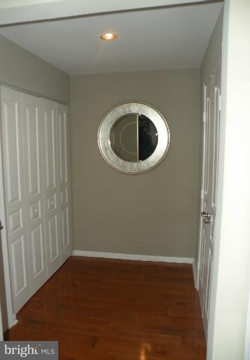 12000 Market Street, Unit 438 Reston, VA 20190 - Photo 10 of 13 a big room with wooden floor
