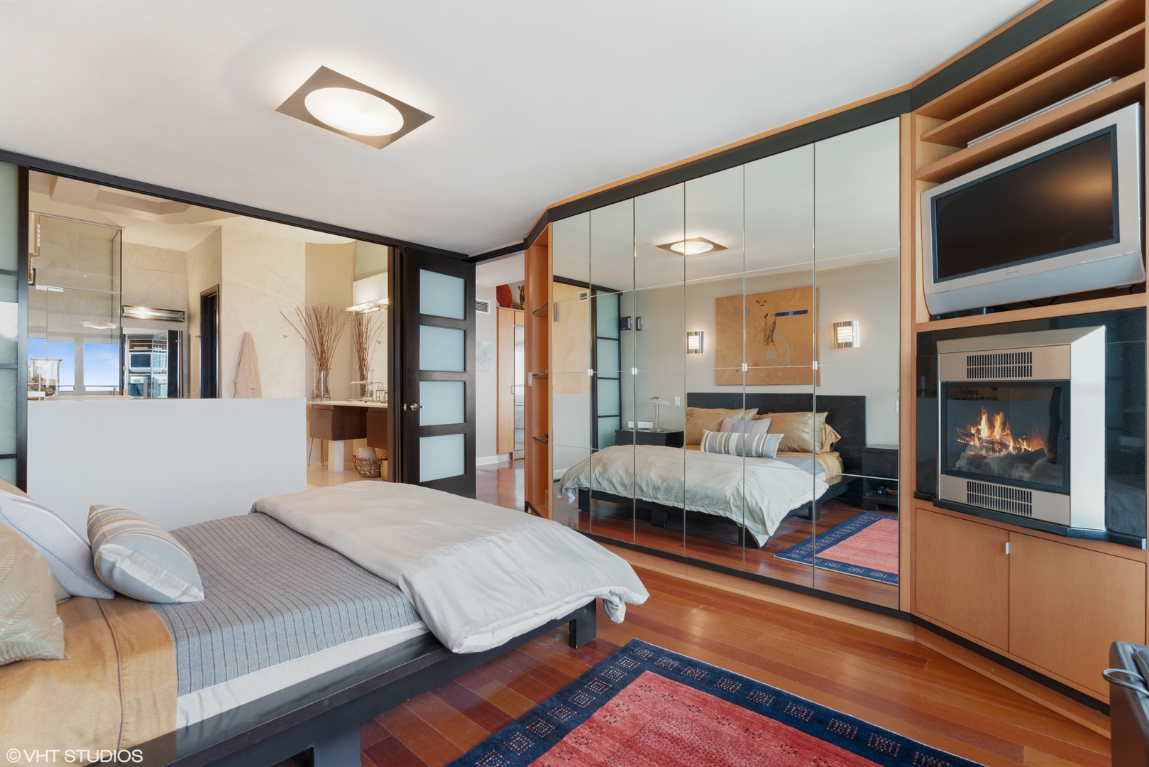 1030 North State Street, Unit 39B Chicago, IL 60610 - Photo 15 of 23 a bedroom with a bed and a fireplace
